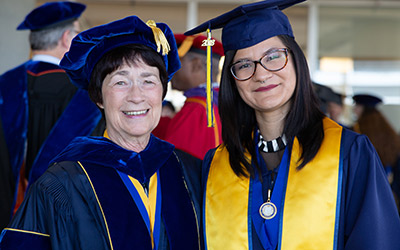 Chancellor Leland with student speaker Santana Juache.