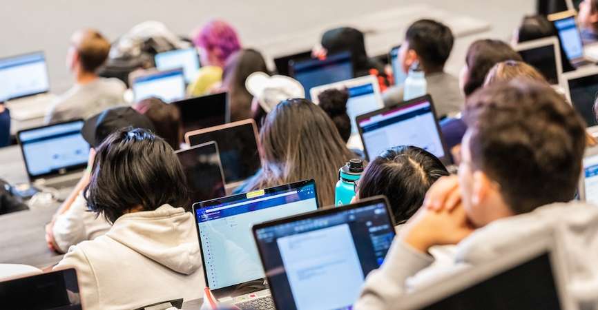 Students work at computers at UC Merced. 