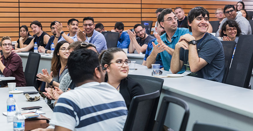 Conference attendees and faculty members share math discussions