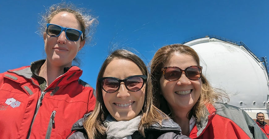 The UC Merced astrophysicists with the Keck Observatory behind them