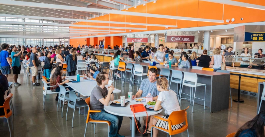 A large crowd of campus community members stand in line for food at UC Merced's new dining center, The Pavilion.