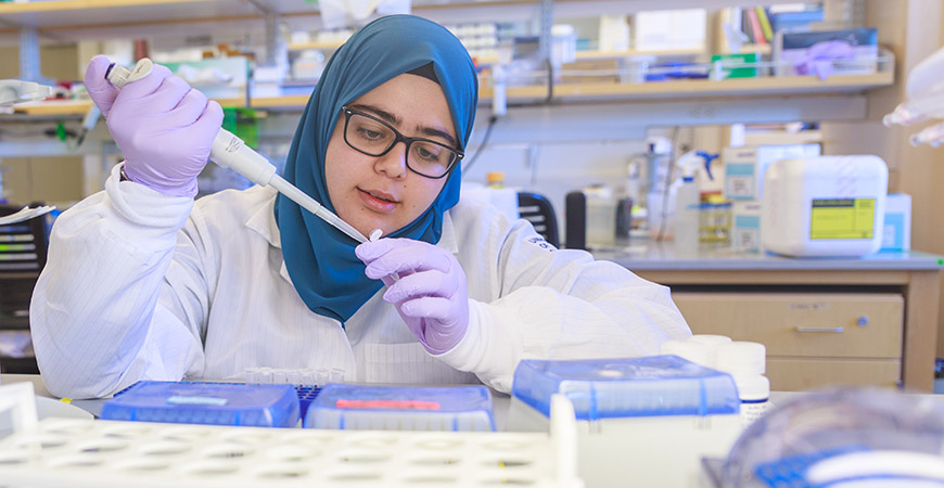 A picture of Mohamed in a lab