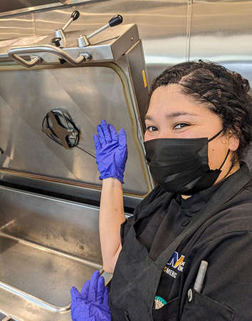 UC Merced kitchen worker and repaired cooker.